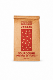 Kraft paper bag with red design and text on a white background