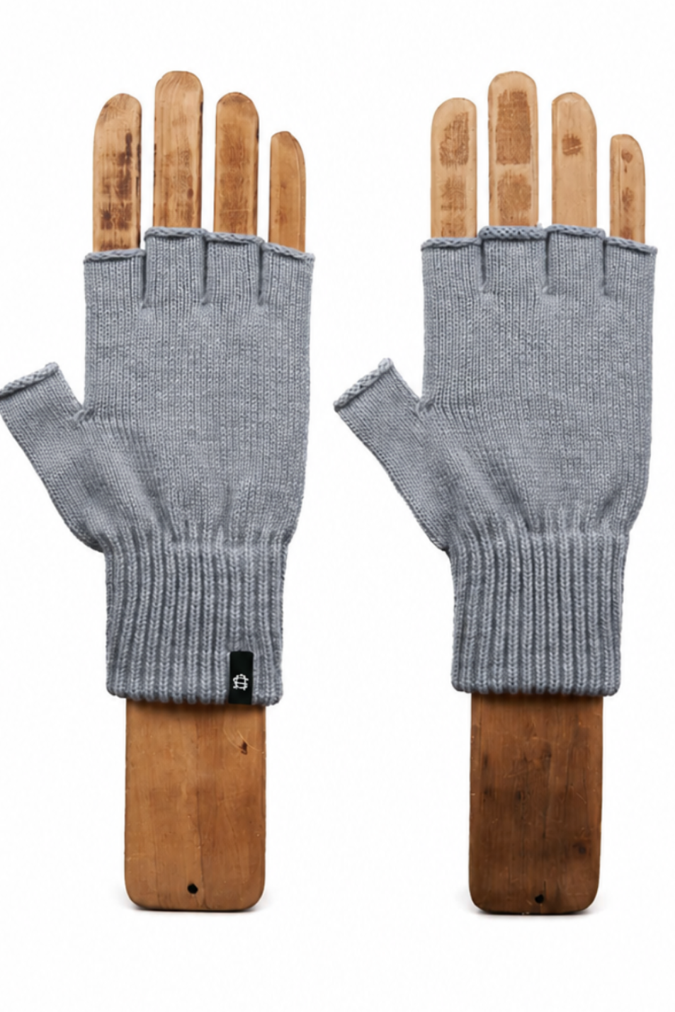 A pair of gray fingerless knit gloves displayed on wooden mannequin hands against a plain white background.