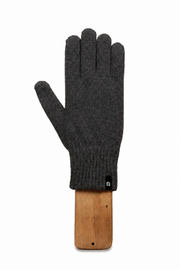 A single dark charcoal gray knit glove displayed on a wooden hanger against a solid white background.