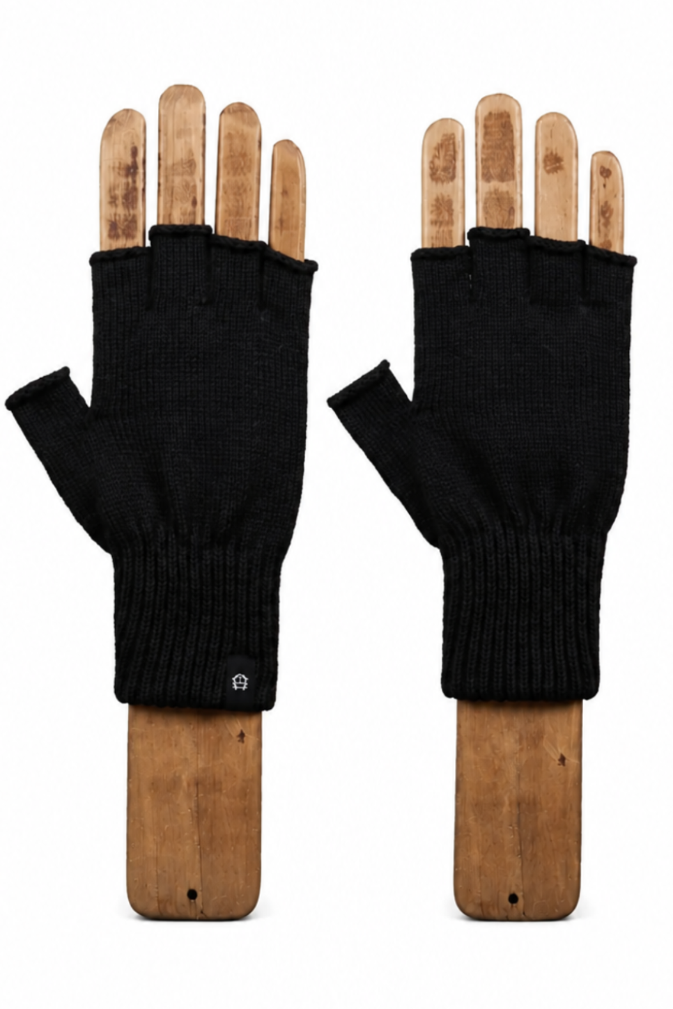 A pair of black fingerless knit gloves displayed on wooden mannequin hands against a plain white background.