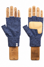A pair of fingerless knit gloves in heathered navy blue, displayed on wooden hand forms against a plain white background. One glove shows the textured knit body and thumb cutout, while the other shows a beige suede or leather patch on the back of the hand.