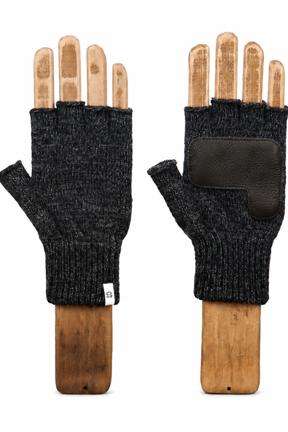 A pair of dark charcoal gray knit fingerless gloves displayed on wooden mannequin hands, showing both the front and back views against a plain white background.