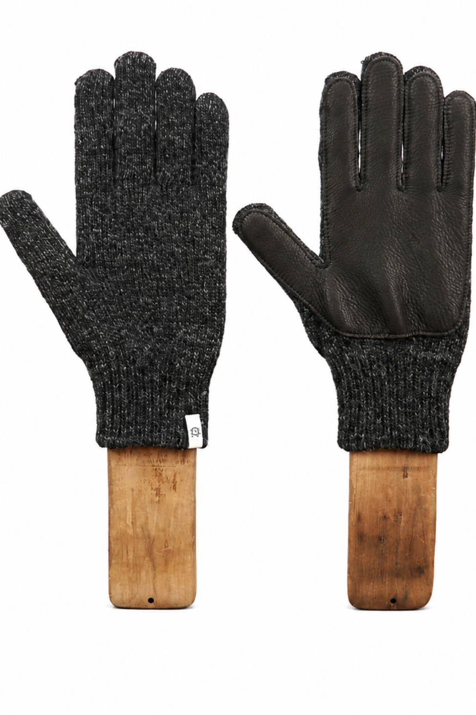 A pair of knit and leather work gloves displayed side-by-side on wooden mannequin hands against a plain white background.