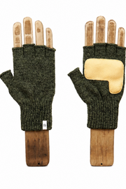 A pair of dark olive green fingerless knit gloves displayed on wooden hand forms against a plain white background. One glove is shown from the back, featuring a light tan suede patch on the knuckle area.