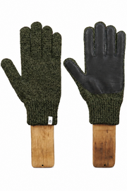 A pair of knit gloves displayed side by side on wooden hangers against a plain white background. One glove shows the textured olive green knit body, and the other shows the black leather palm side.