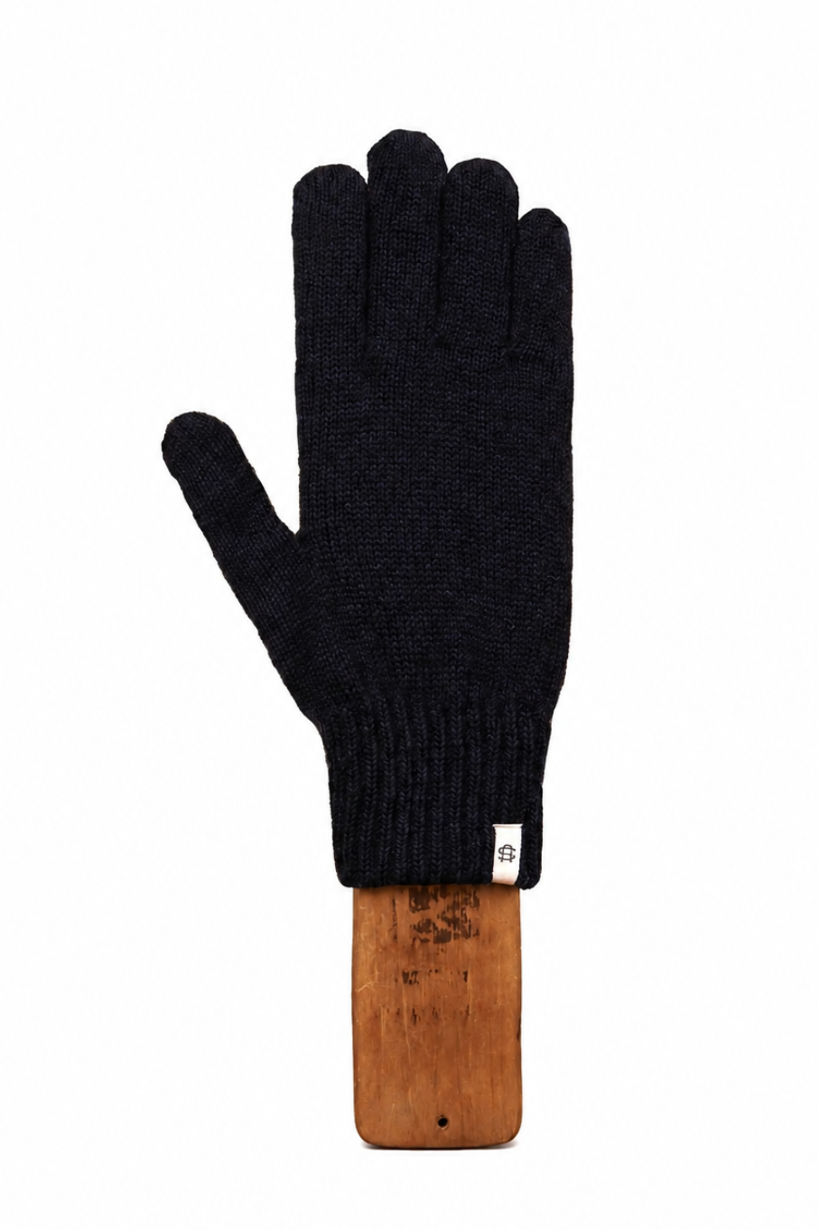 A single black knit glove with a ribbed cuff, displayed flat against a white background on a wooden stand.
