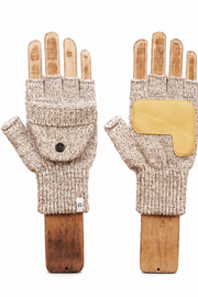 A pair of beige knit fingerless gloves displayed on wooden hand forms against a plain white background. One glove shows a front flap pocket with a small black button, and the other shows a yellow protective patch on the back of the hand.