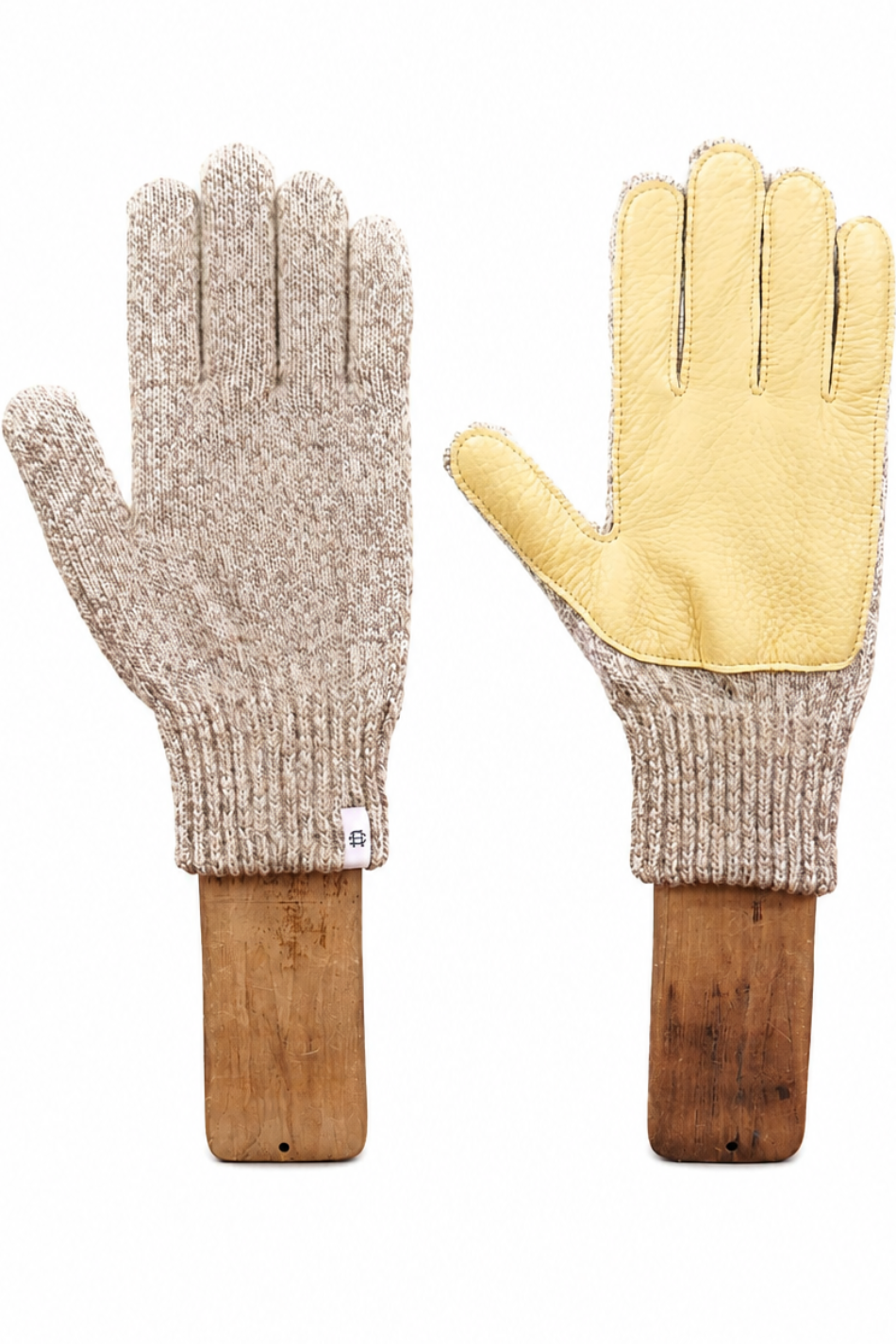 A pair of knit winter gloves displayed side by side on wooden hangers against a plain white background. One glove shows the beige heathered knit palm side, and the other shows the light yellow leather back side with black stitching.
