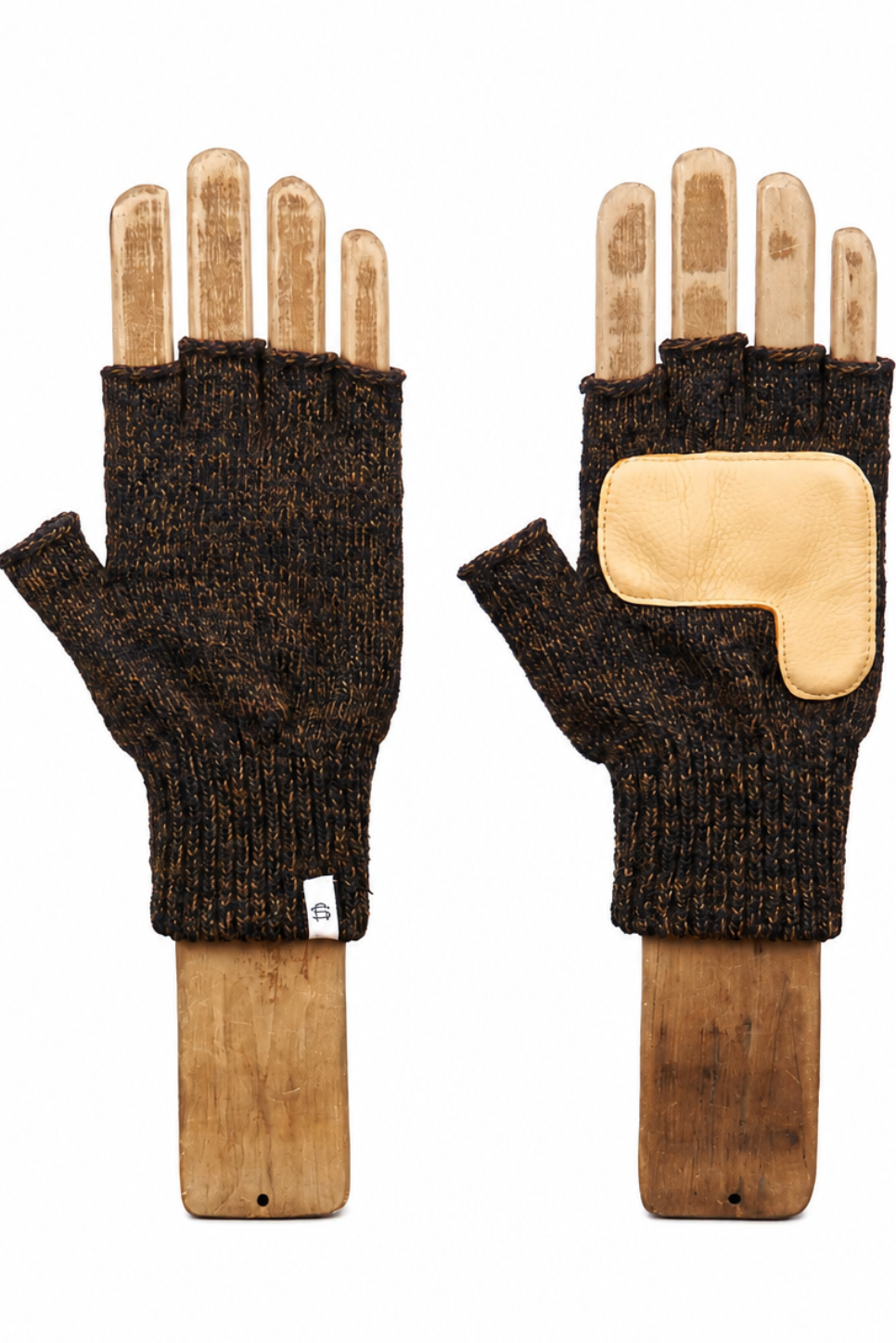 A pair of dark brown heathered knit fingerless gloves with tan leather palm and back patch, displayed on wooden hand mannequins against a white background.