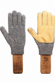 A pair of knit work gloves displayed side by side on wooden mannequin hands against a plain white background. One glove is shown from the back in heather gray, and the other is shown from the palm side, featuring light tan leather palms and a gray knit cuff.