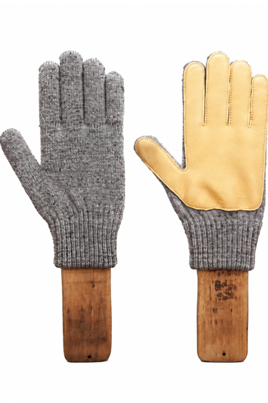 A pair of knit work gloves displayed side by side on wooden mannequin hands against a plain white background. One glove is shown from the back in heather gray, and the other is shown from the palm side, featuring light tan leather palms and a gray knit cuff.