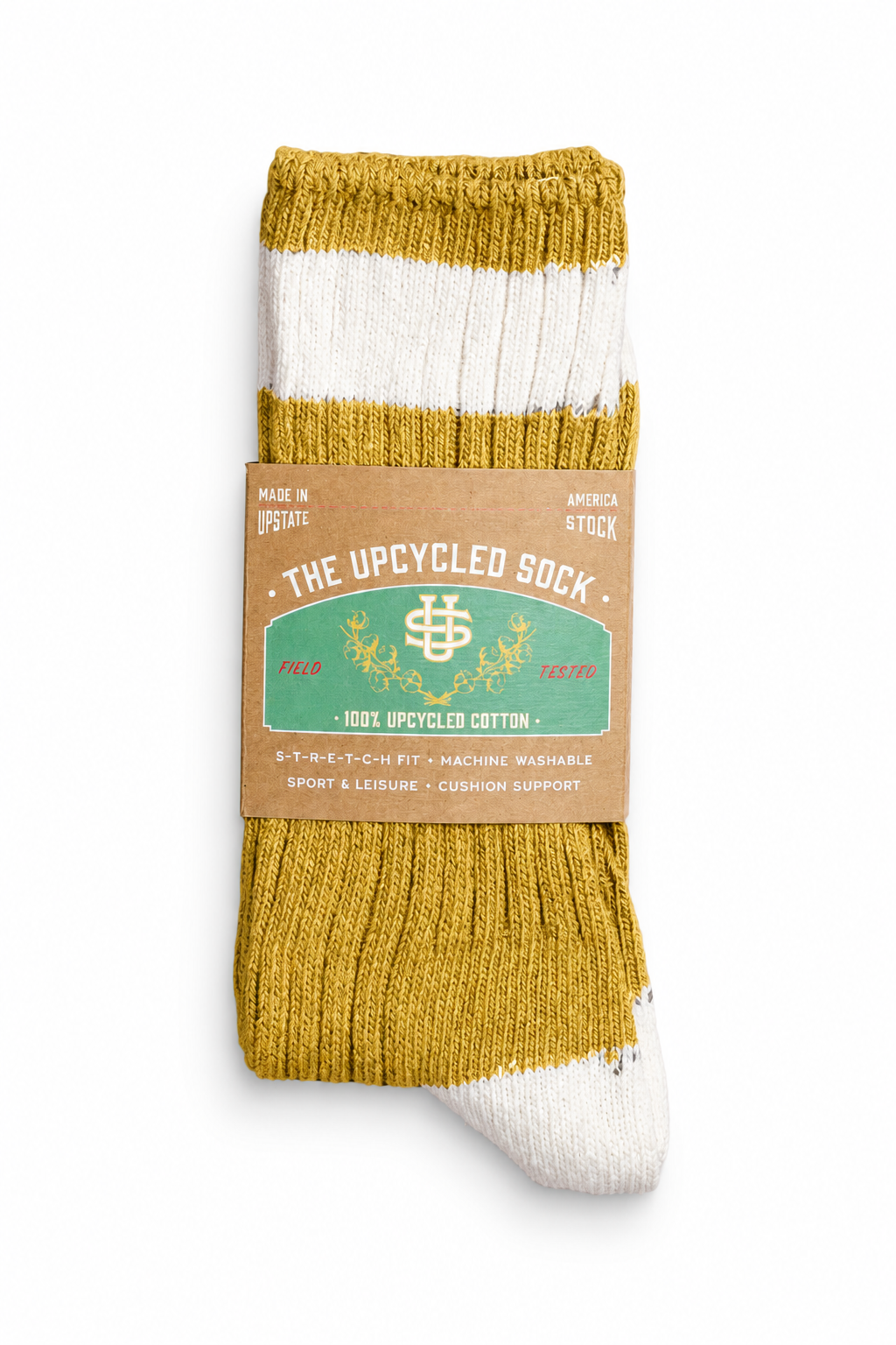 A single pair of striped crew socks in mustard yellow and white, wrapped in a brown paper band labeled 'THE UPCYCLED SOCK'.