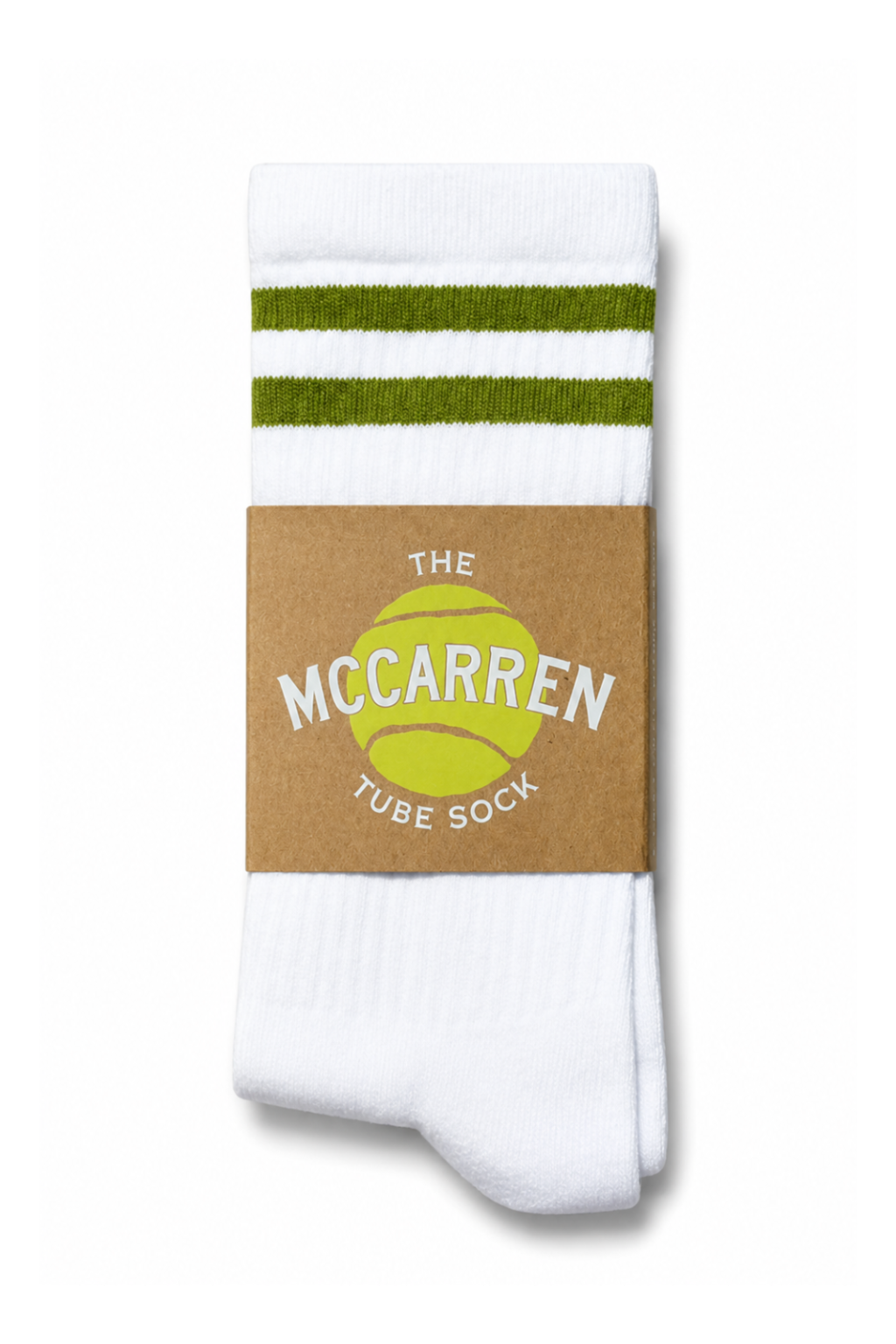 A pair of white tube socks with two green stripes near the top, wrapped in a brown paper band featuring a yellow tennis ball graphic and the text 'THE MCCARREN TUBE SOCK'.