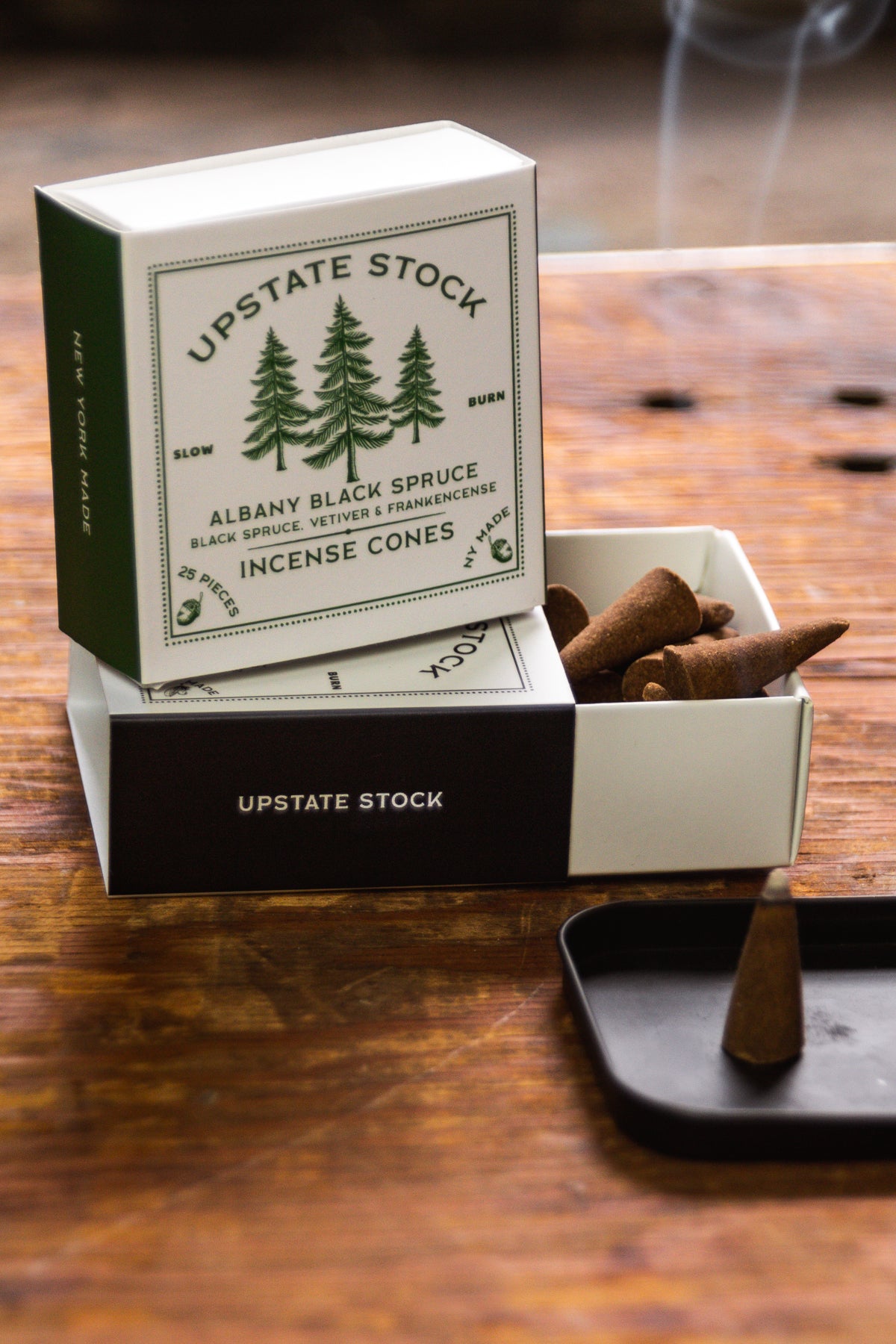 Close up of Upstate Stock Incense cone boxes.